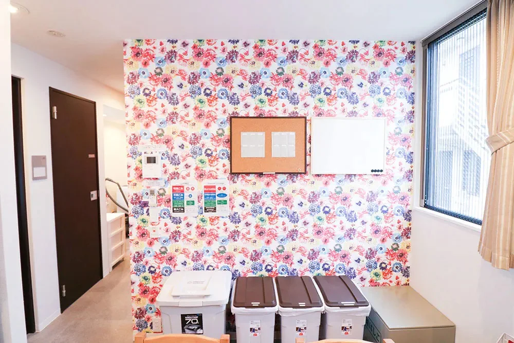 Trash cans and bulletin board